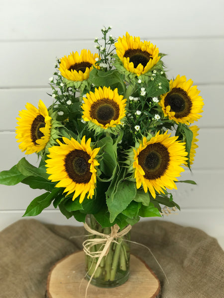 Sunflower floral arrangement in a vase for Fall from a local flower shop in Belmar, New Jersey Gig Morris Florist