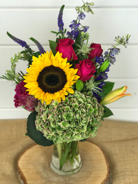 A wildflower collection for the fall of sunflowers, antique hydrangea, roses, Larkspur and other fall favorites of custom florals