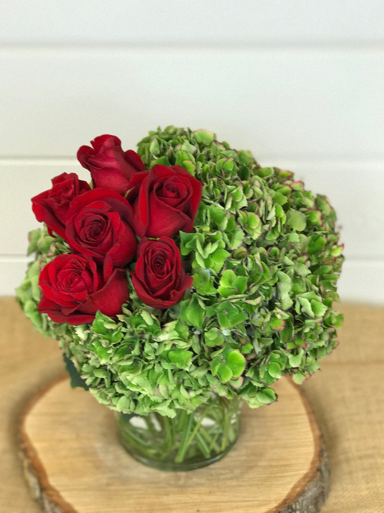 Compact vase arrangement of hydrangea and red roses local flower shop in Belmar, New Jersey Gig Morris Florist